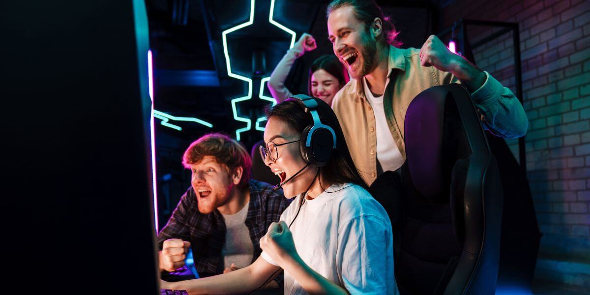 groups of gamers cheering at PC