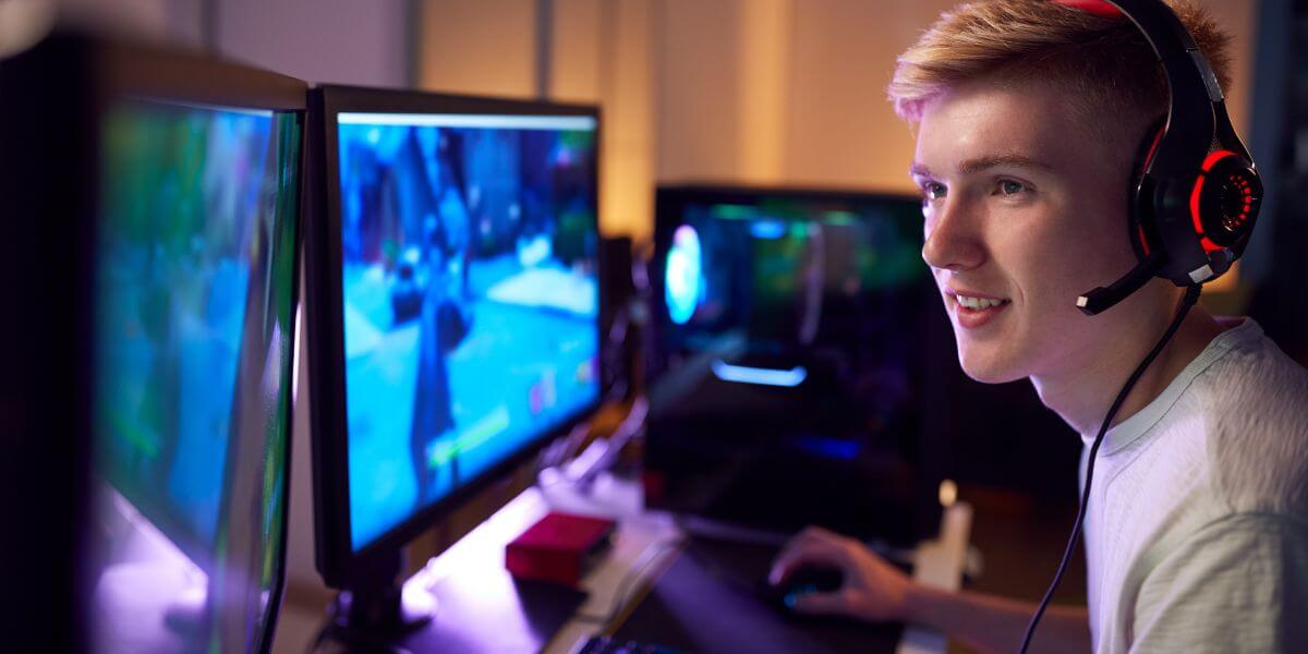 gamer playing on dual monitors