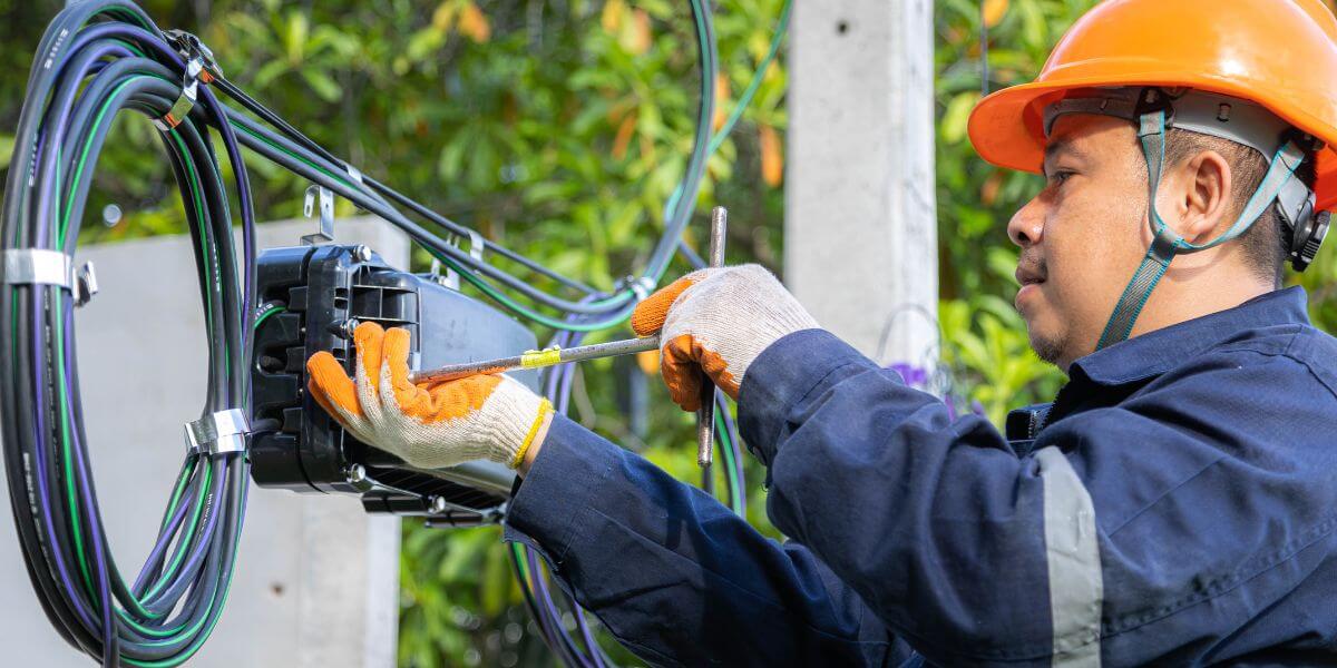 worker installing fiber internet equipment
