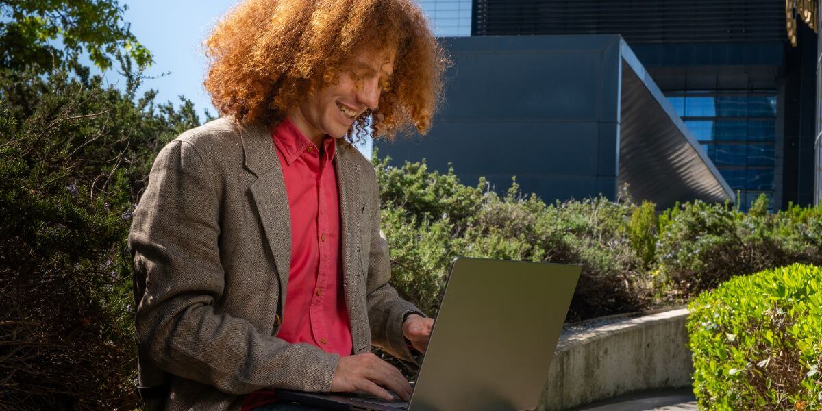 person working on laptop outside
