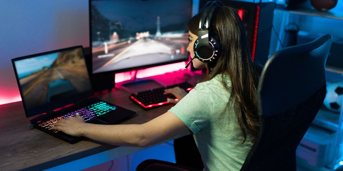 teen gaming on laptop