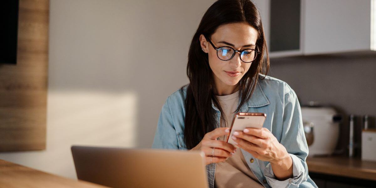 woman looping at phone