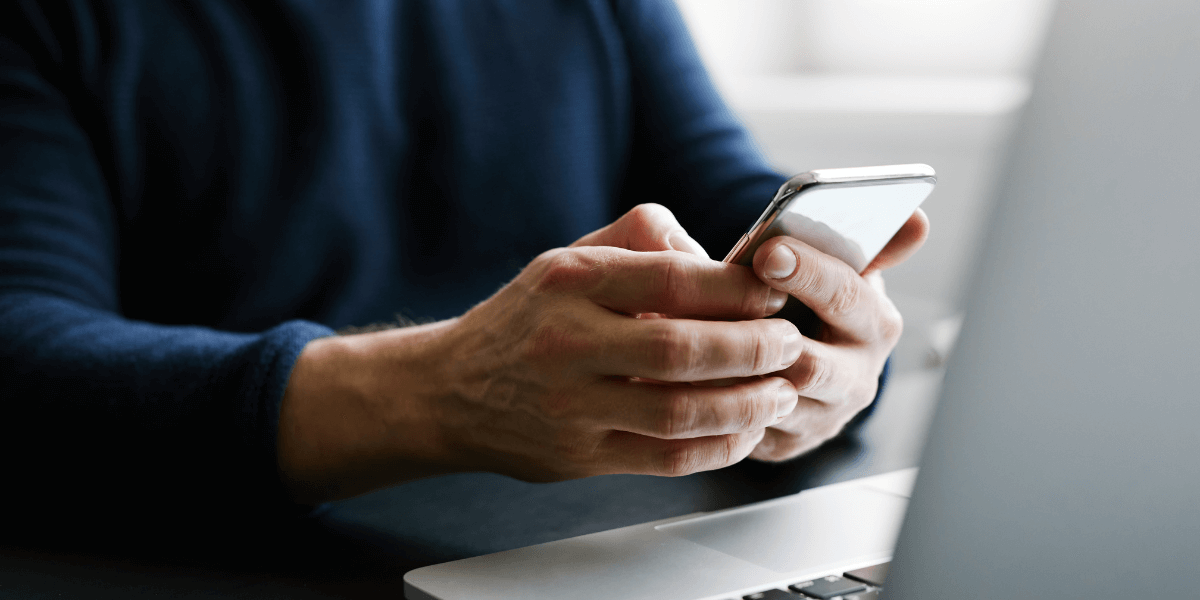 man using his cell phone