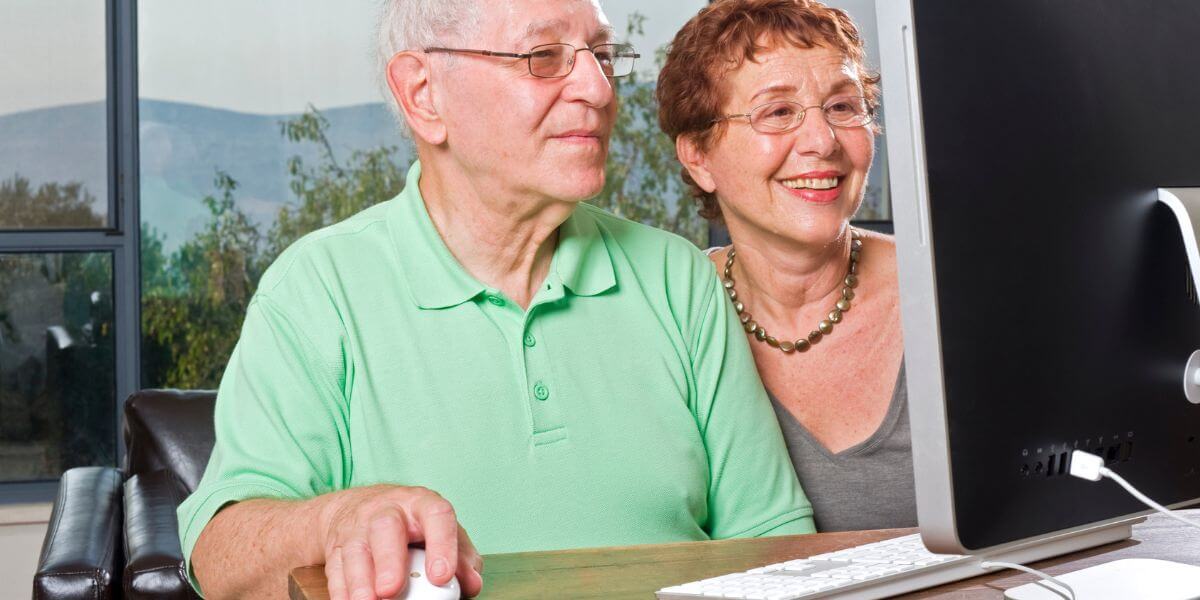 senior couple using computer