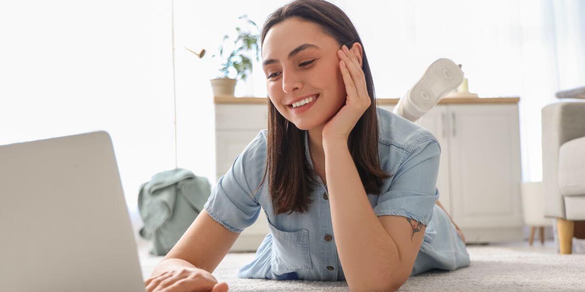 woman smiling on using laptop