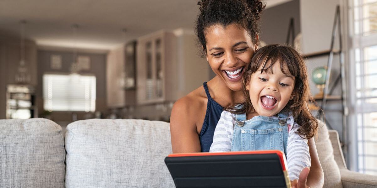 woman and child using tablet