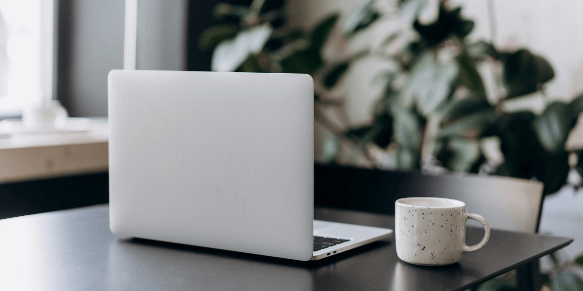 laptop and coffee on a table