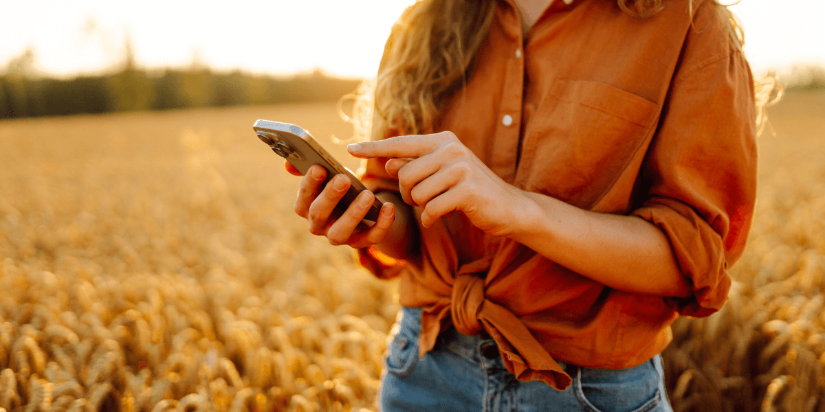 woman using internet in a field