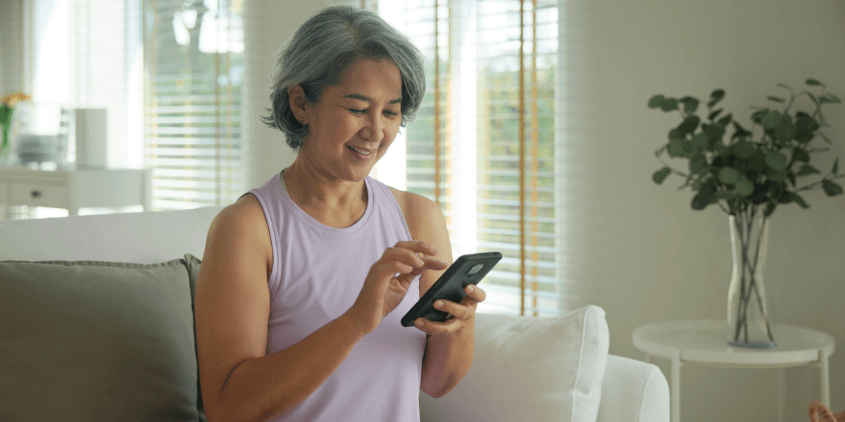 older woman looking at her cell phone