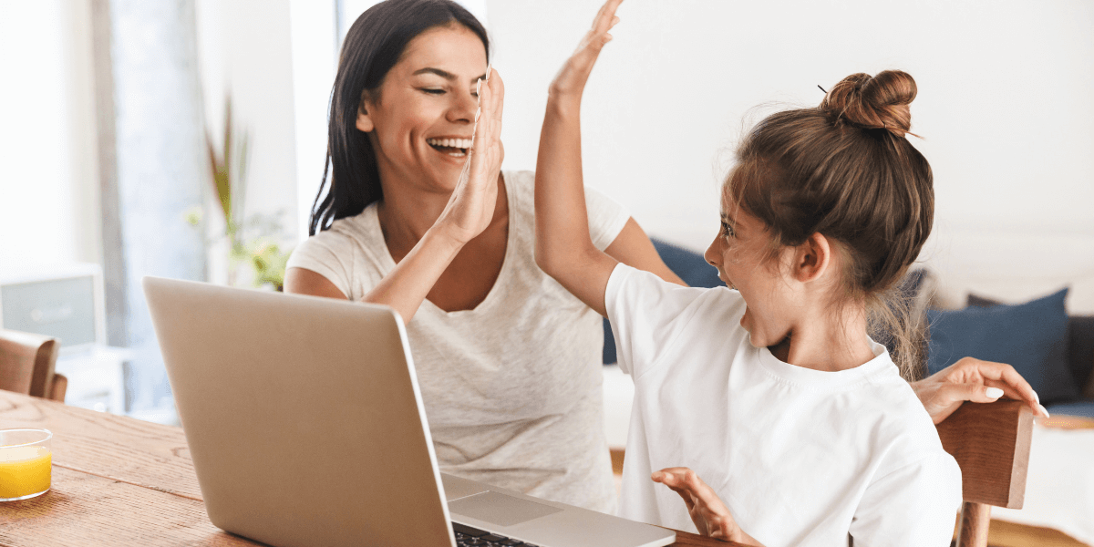 woman and child high fiving