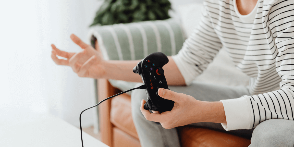 person holding a gaming controller