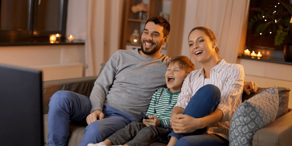 Family watching tv together