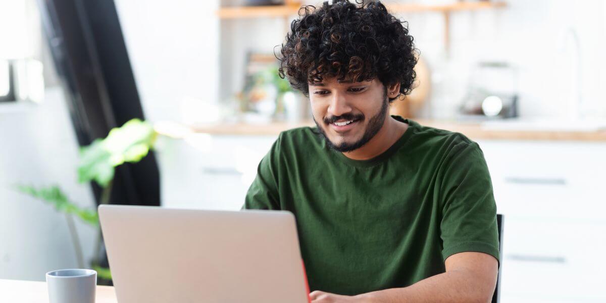 male student using laptop