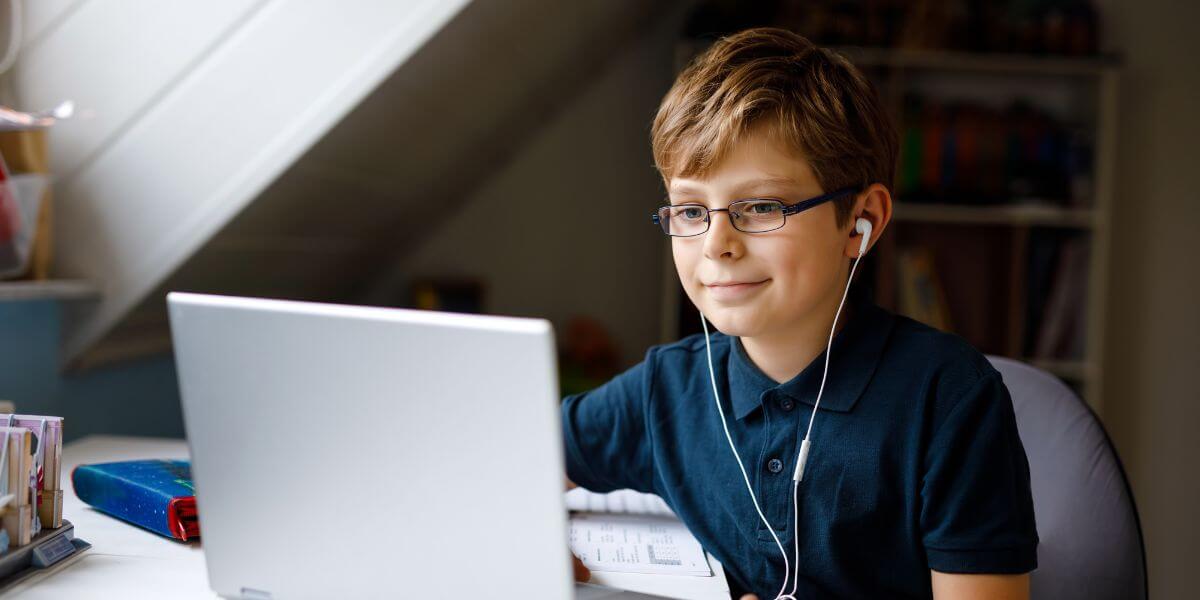 student kid using laptop