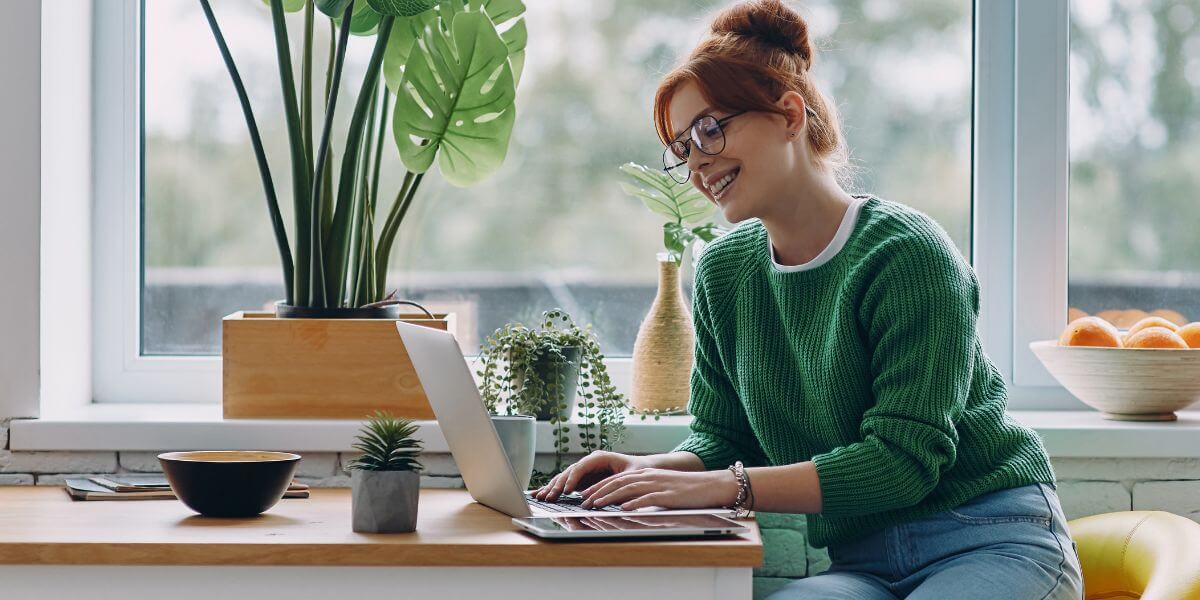 woman using laptop on table