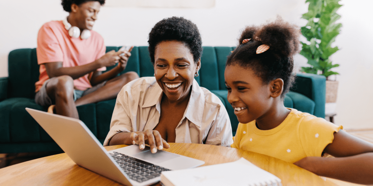 woman and child on laptop, son on phone