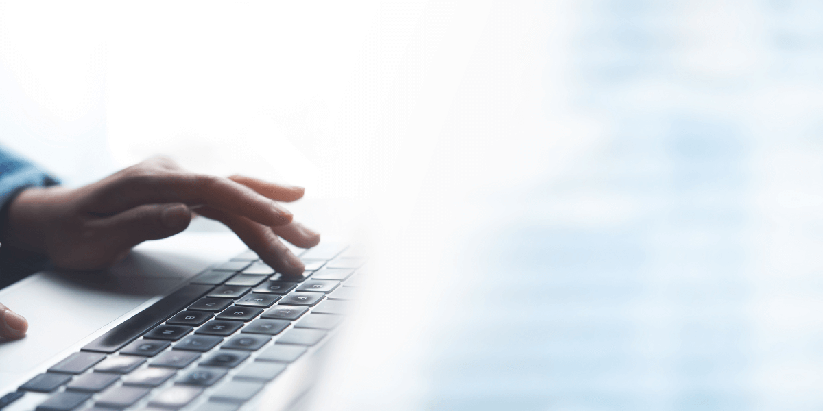 hand typing on keyboard