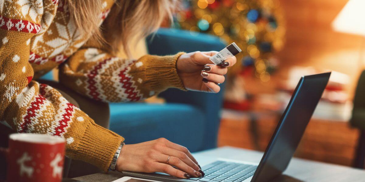 woman holiday shopping on laptop