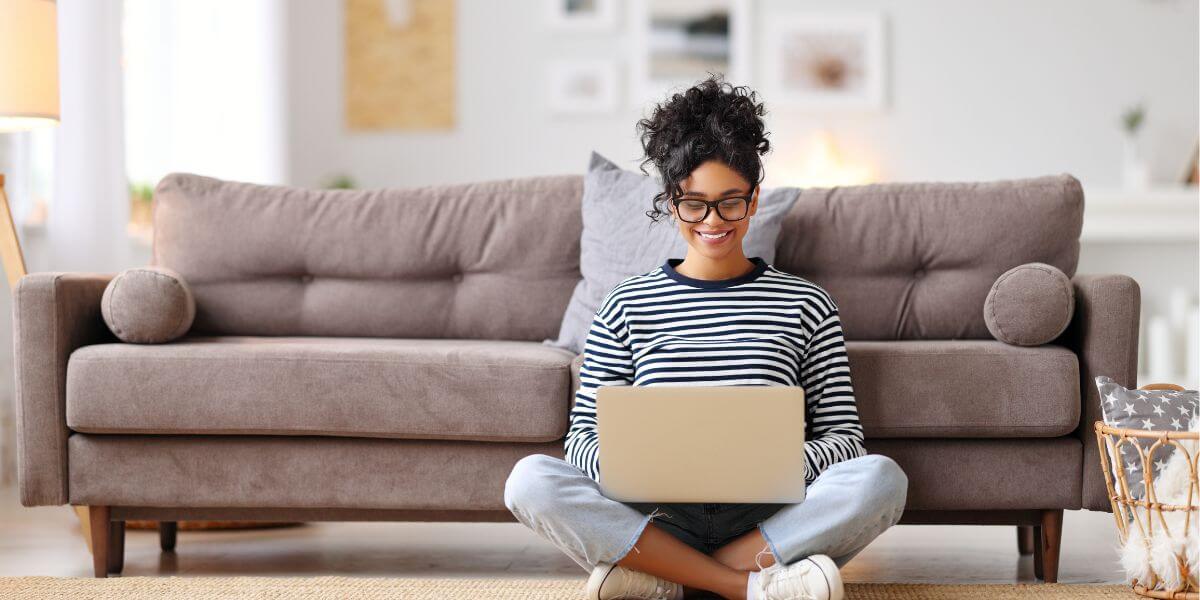woman on floor using laptop