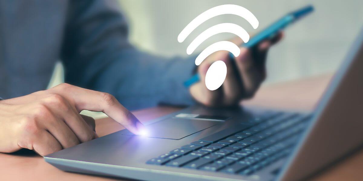 person using phone to connect to laptop