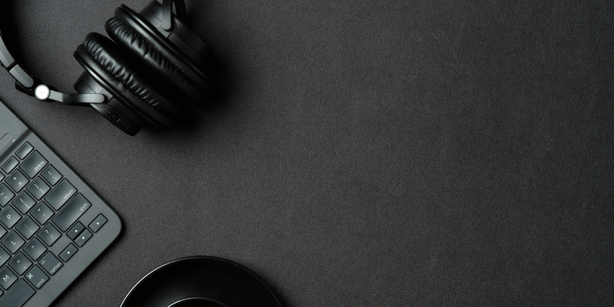 flat lay of computer and headphones