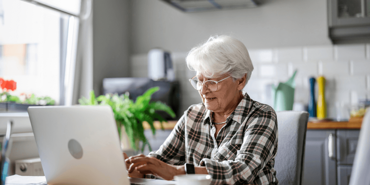 older woman using a laptop