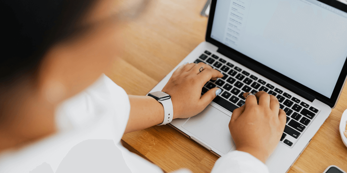 person typing on a laptop