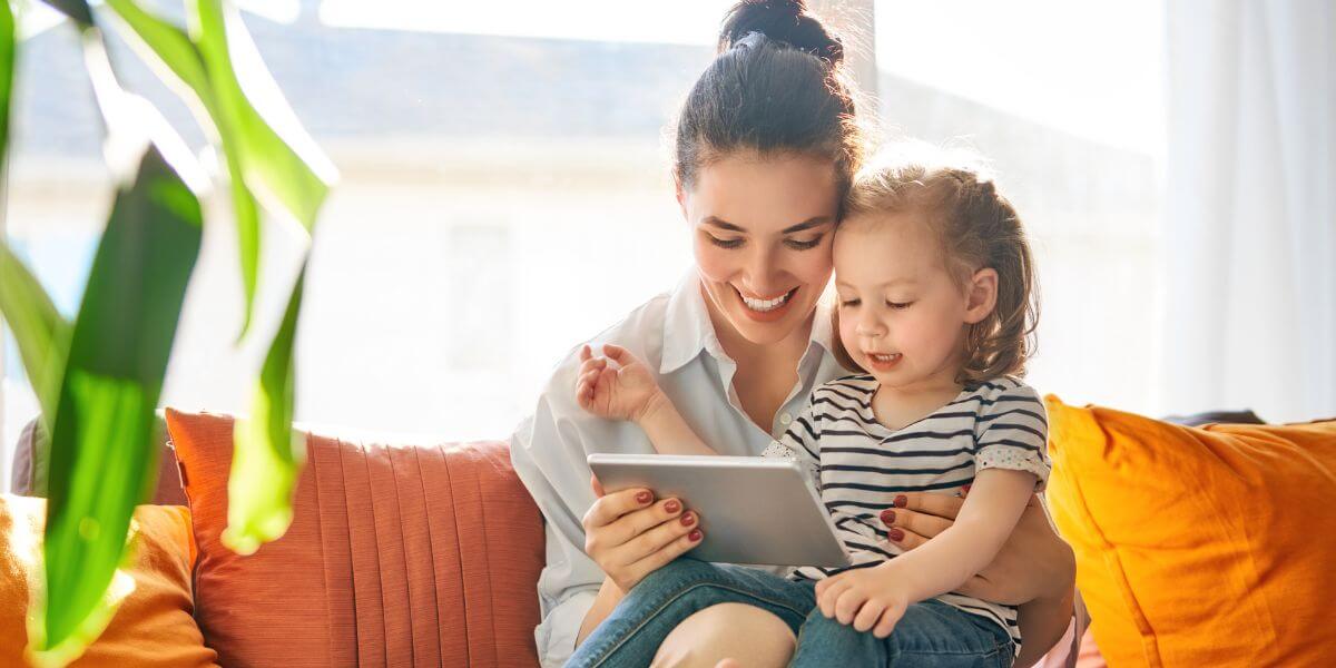 woman and child using tablet