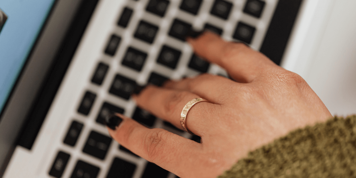 hand typing on a keyboard
