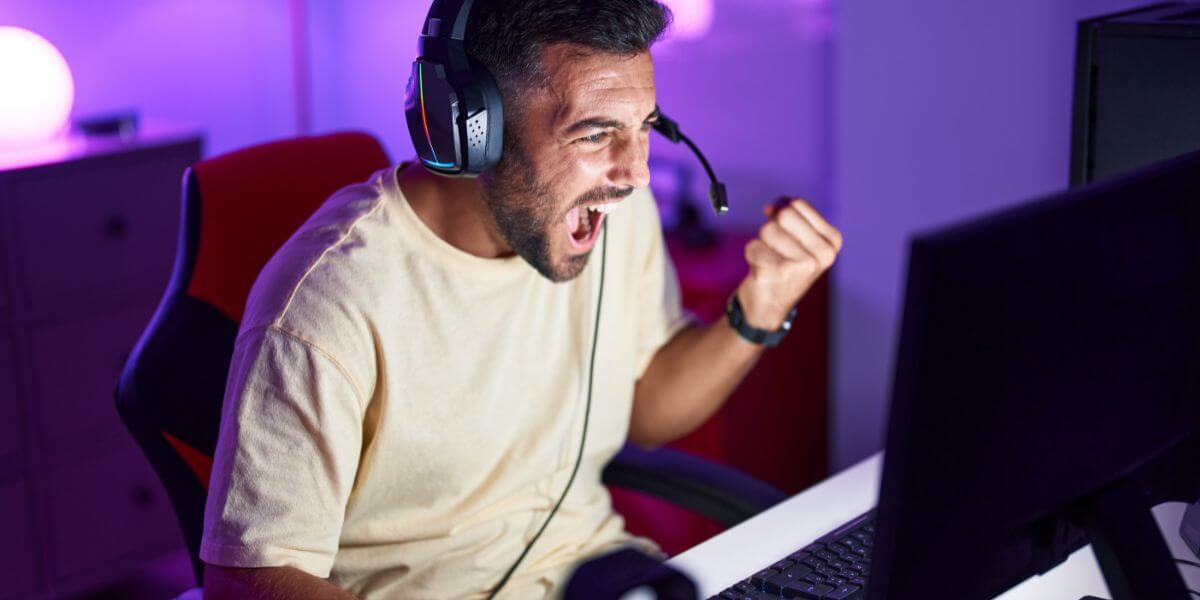 man playing pc games