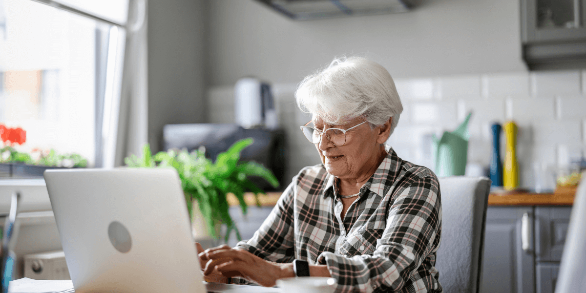 older woman using a laptop