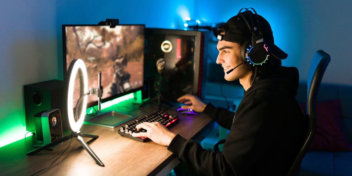 guy gaming on computer