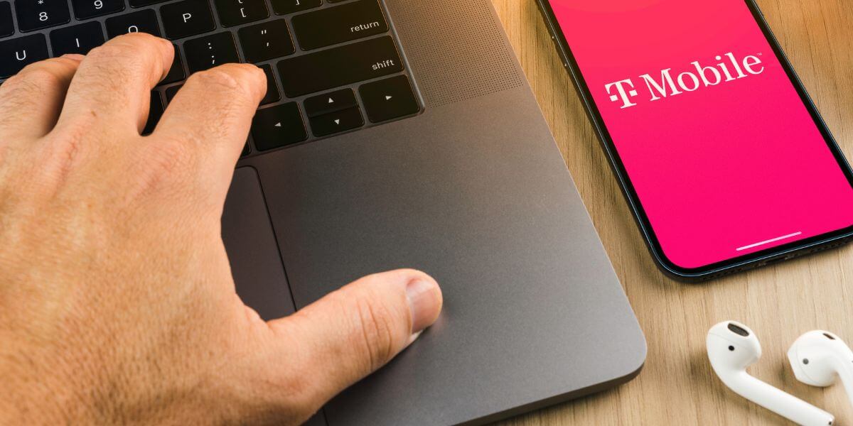 laptop and phone with T-mobile logo