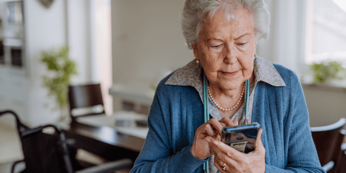older woman looking at her phone