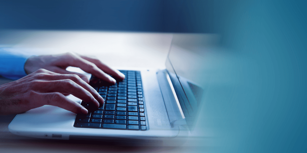 person typing on a keyboard