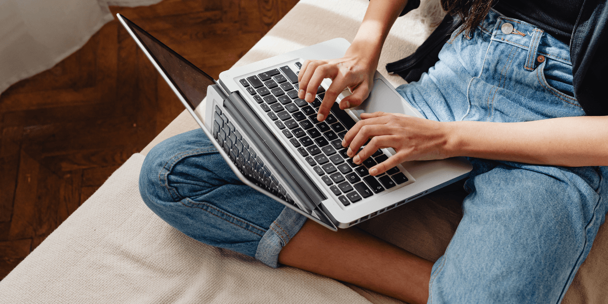 person typing on a laptop