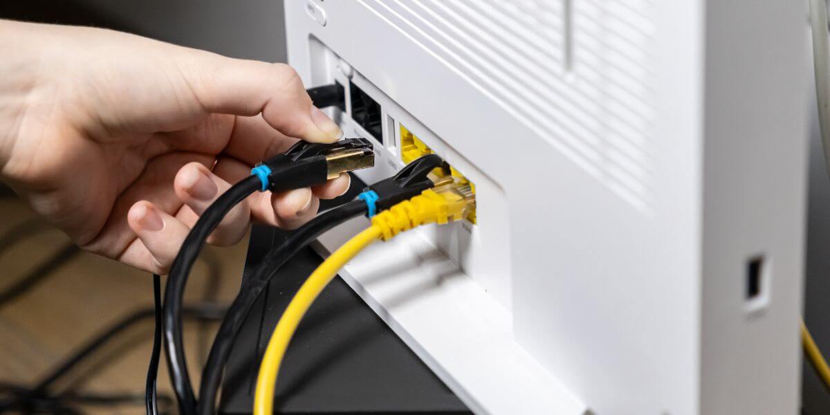 hand plugging cord in modem