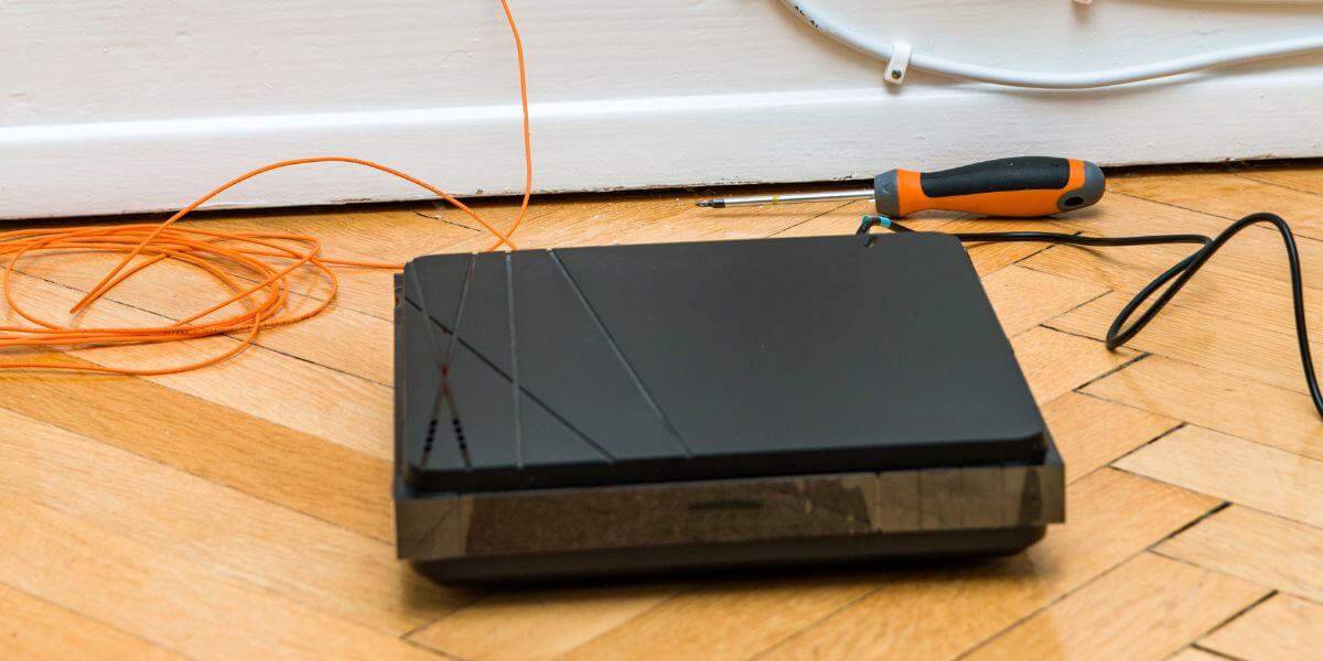 black modem on floor