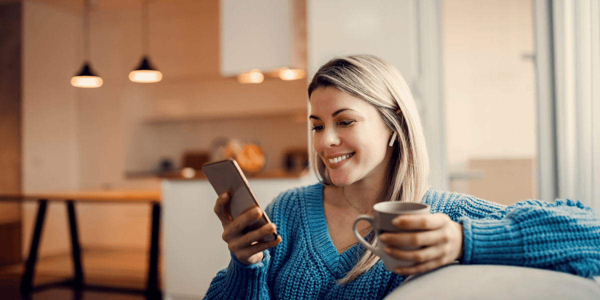 woman smiling at phone