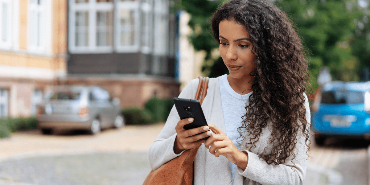 woman looking at her phone
