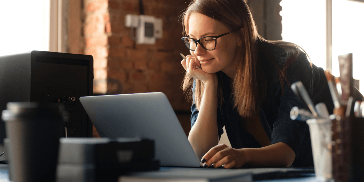 woman looking at her laptop