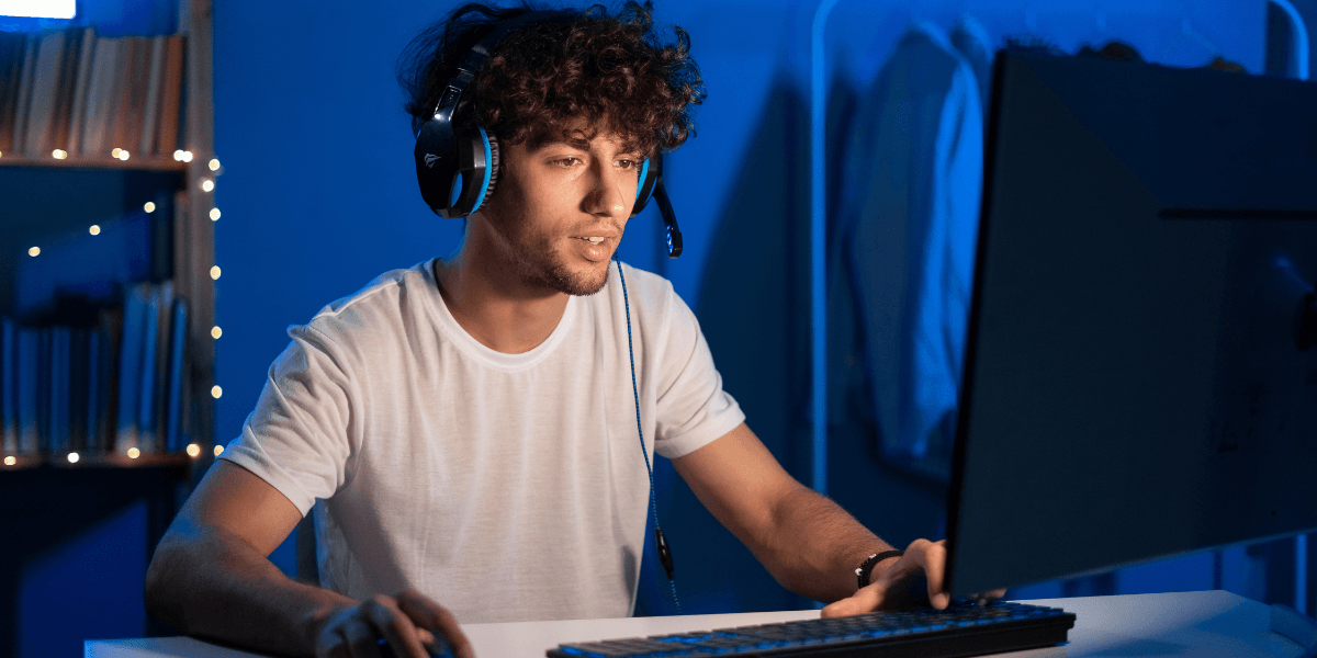 teen playing video games on PC
