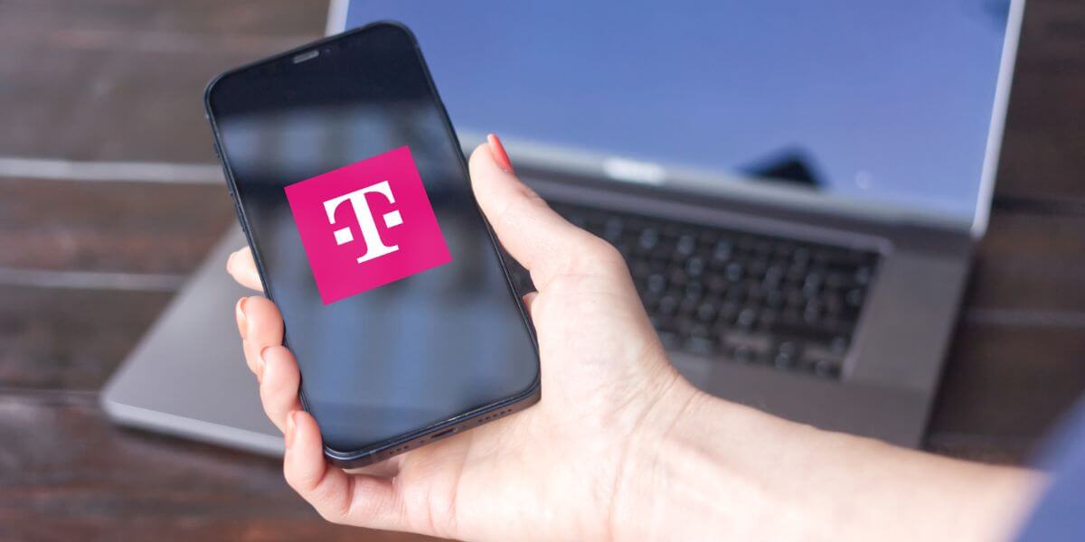 hand holding phone with t-mobile logo