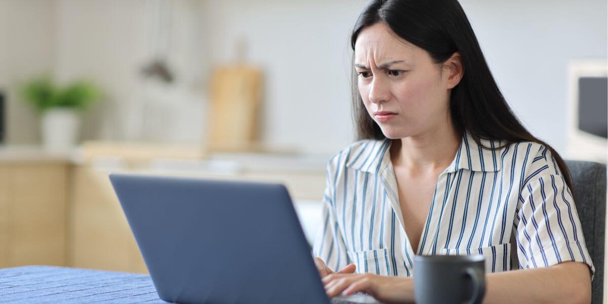 woman looking at laptop