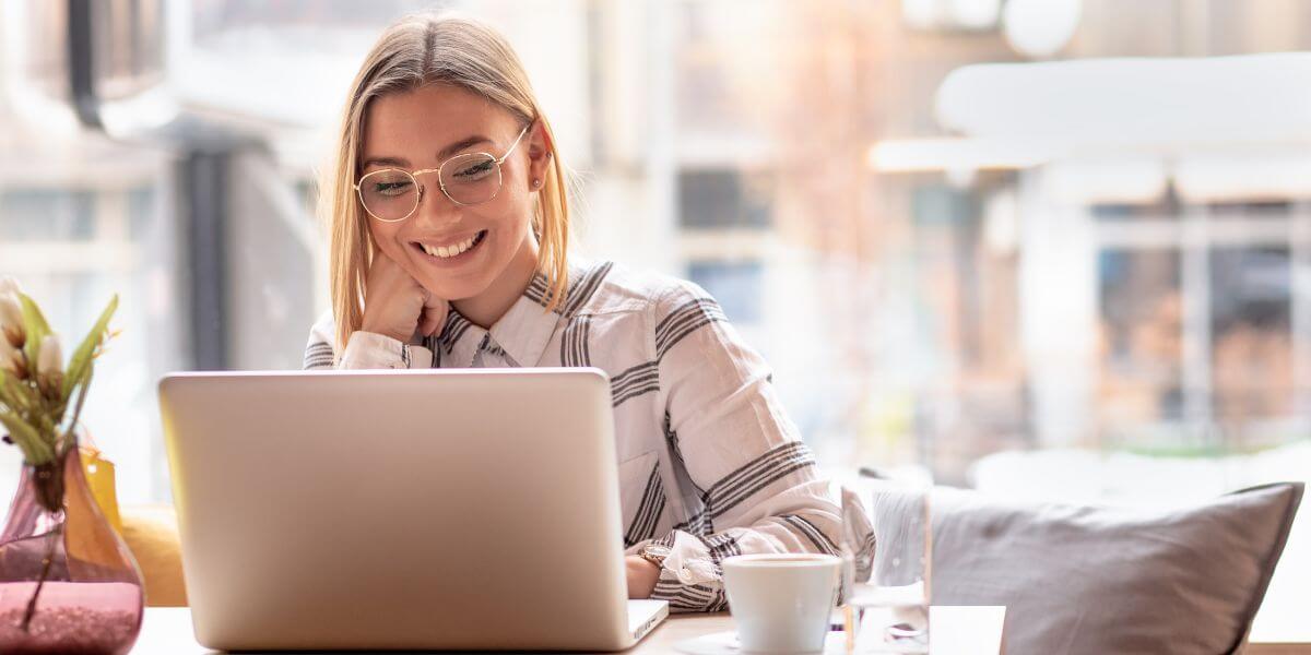 woman using laptop at table