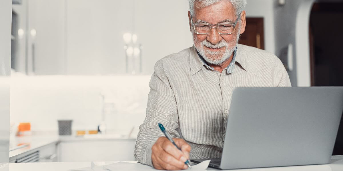 senior man using laptop