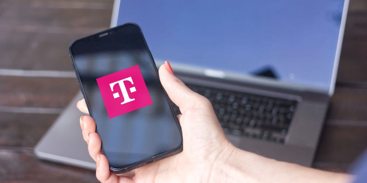 person holding phone with t-mobile logo