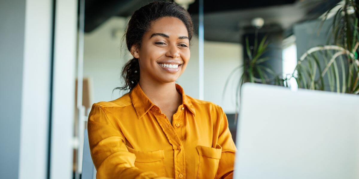 woman using laptop at table