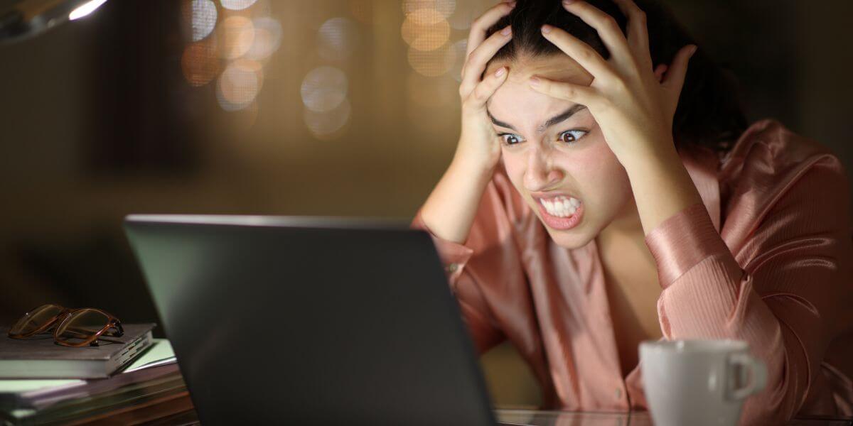 stressed woman using laptop