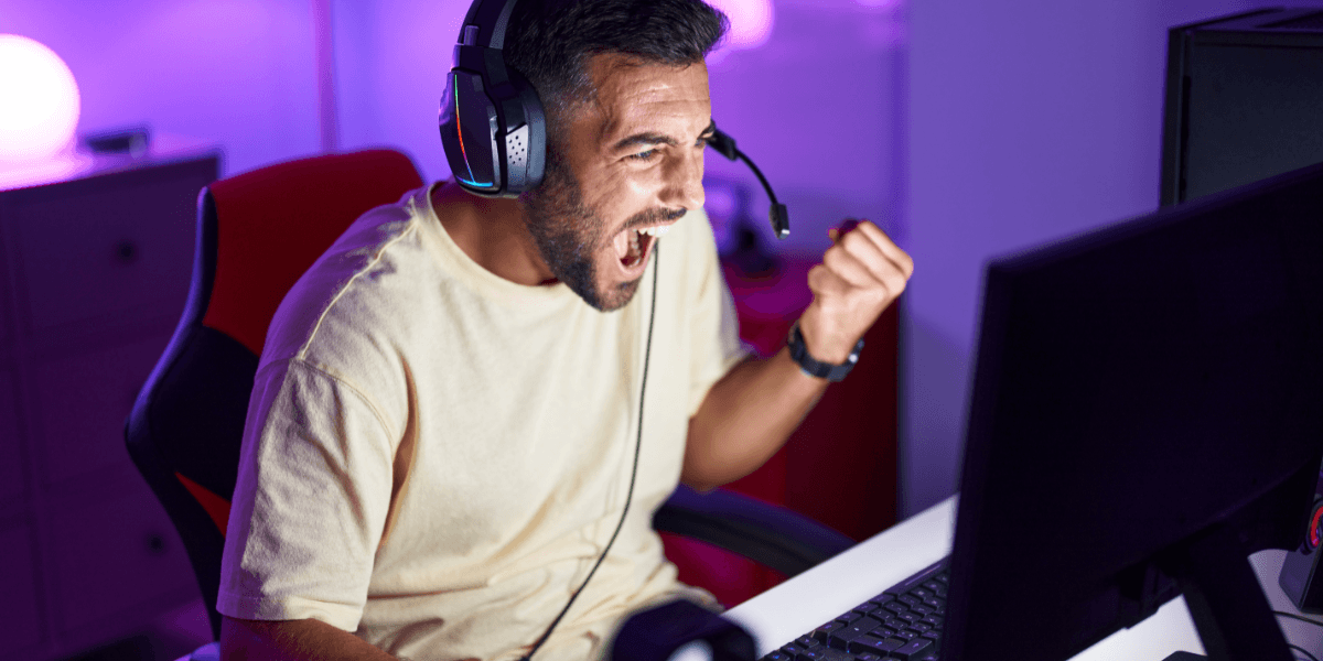 man smiling playing video games